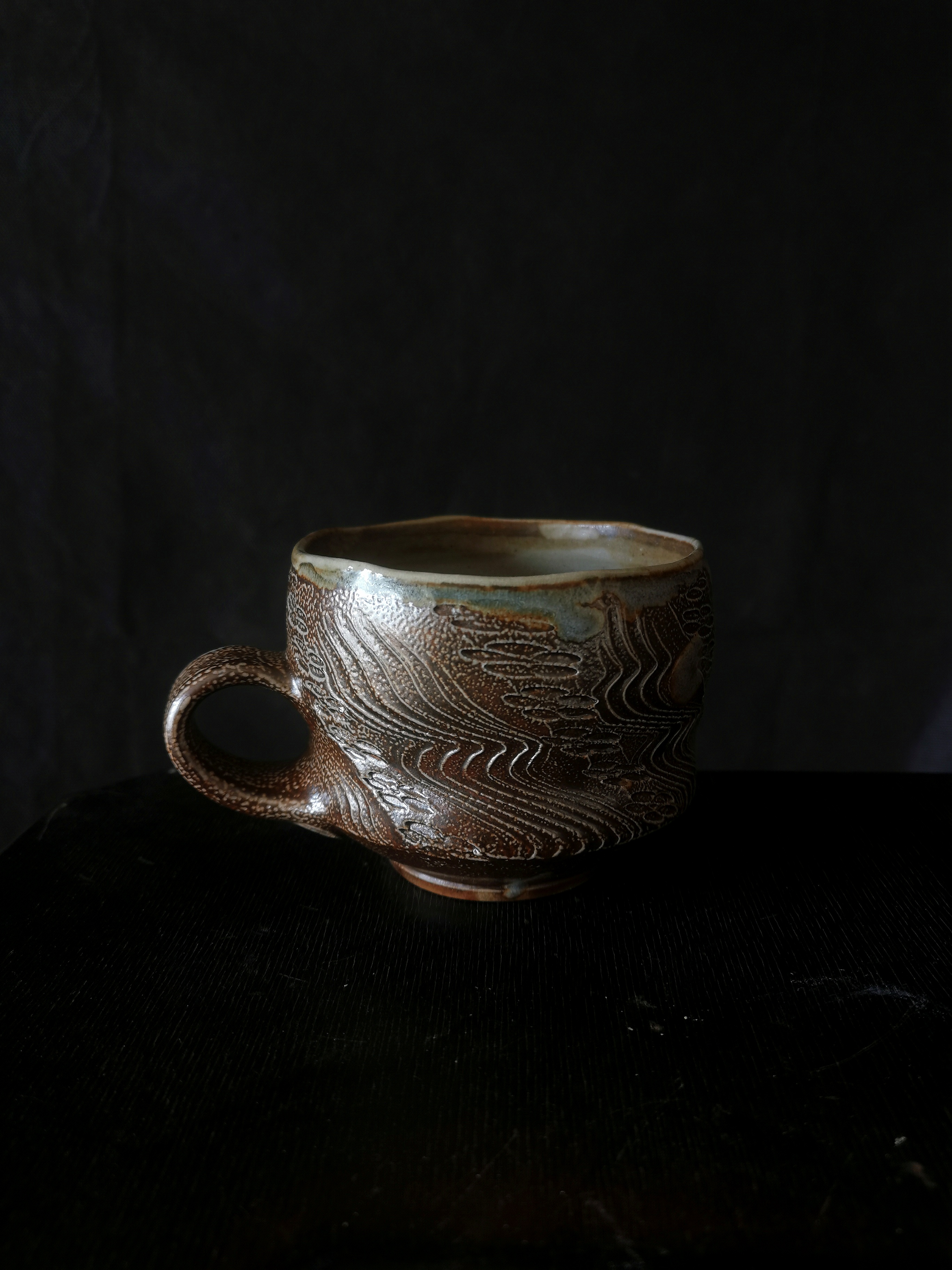 Salt-glazed cup with patterns